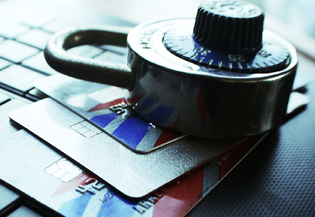 Padlock on credit cards and keyboard