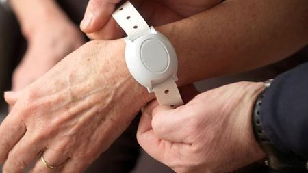A piece of tracking technology is placed on a user's wrist.